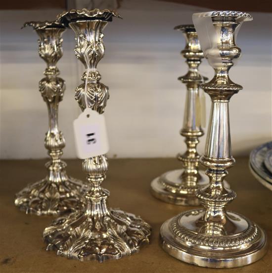 Two pairs of plated candlesticks, one acanthus-moulded, the other gadroon-edged